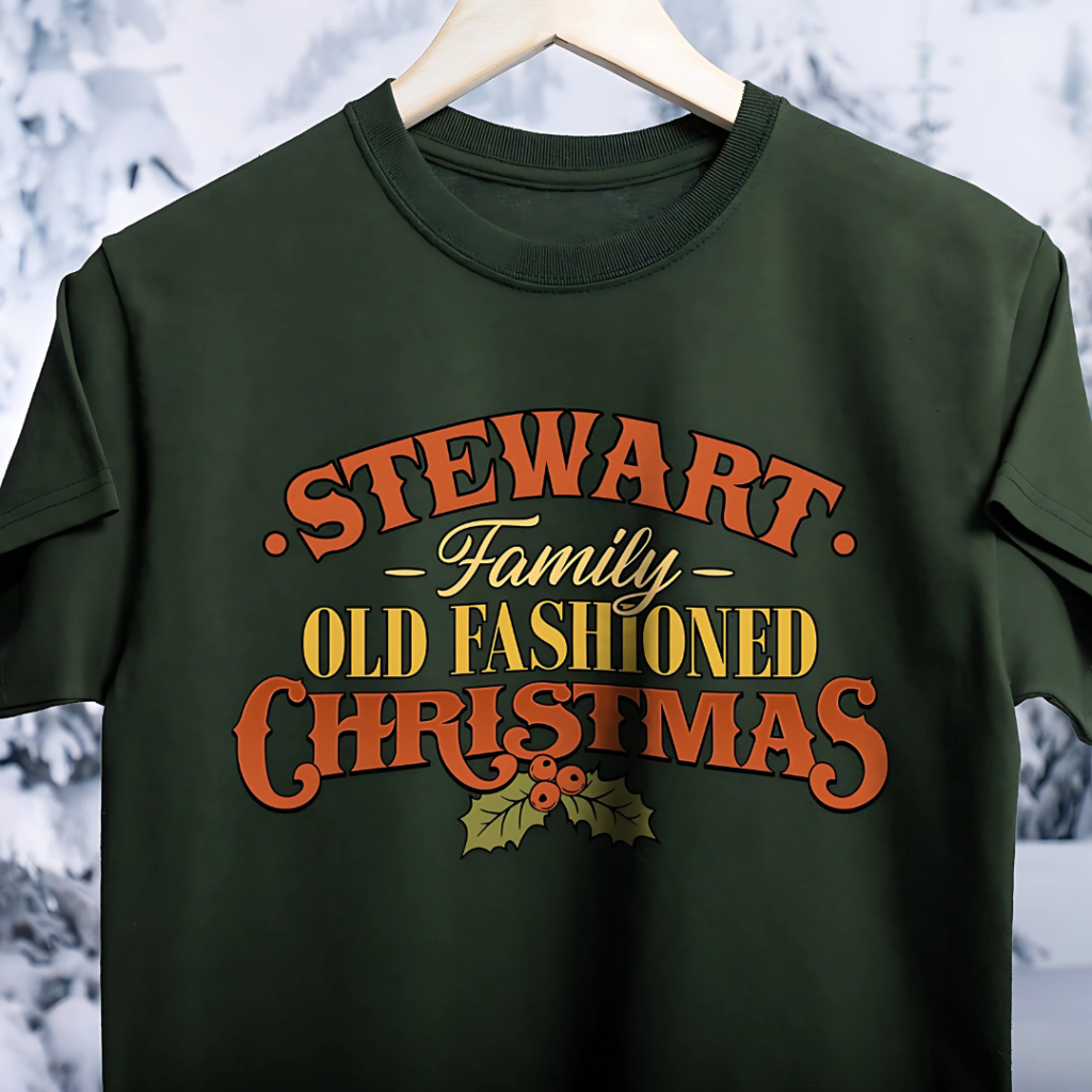 A customized forest green Old Fashioned Christmas tee against a snowy backdrop